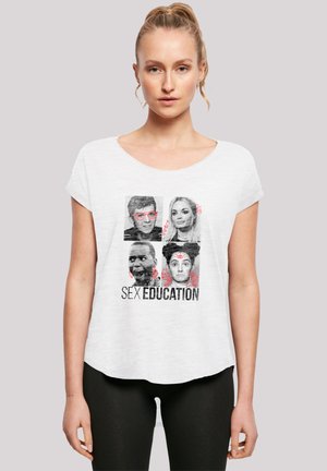 White T-shirt with rounded neckline, featuring a graphic print of four faces above the text "SEX EDUCATION" in bold black letters.