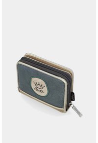 Portafoglio compatto in verde tenue e beige con un patch del logo a forma di corona e scomparto con zip dotato di tirazip con marchio.