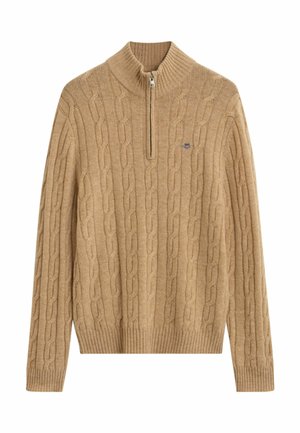 Beige Kabelstrickpullover mit einem halben Reißverschlusskragen, gerippten Bündchen und Saum sowie einem kleinen Logo auf der Brust. Weiche Textur und mittleres Gewicht.
