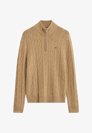 Beige Kabelstrickpullover mit einem halben Reißverschlusskragen, gerippten Bündchen und Saum sowie einem kleinen Logo auf der Brust. Weiche Textur und mittleres Gewicht.