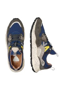 Blue and gray sneaker with a speckled sole, suede and fabric materials, prominent laces, and a cushioned interior. Features yellow detailing.