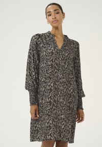 Robe imprimée animal en gris et noir, avec un décolleté en V, de longues manches ballon à poignets smockés et une coupe décontractée.
