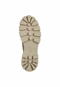Semelle de chaussure beige clair avec un motif de semelle robuste. Présente plusieurs crampons angulaires et hexagonaux pour l'adhérence, marqués de la taille '37'.