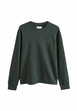 Sudadera verde con escote redondo y mangas largas. Presenta un pequeño logo en el pecho. Hecha de una tela suave con un corte relajado.