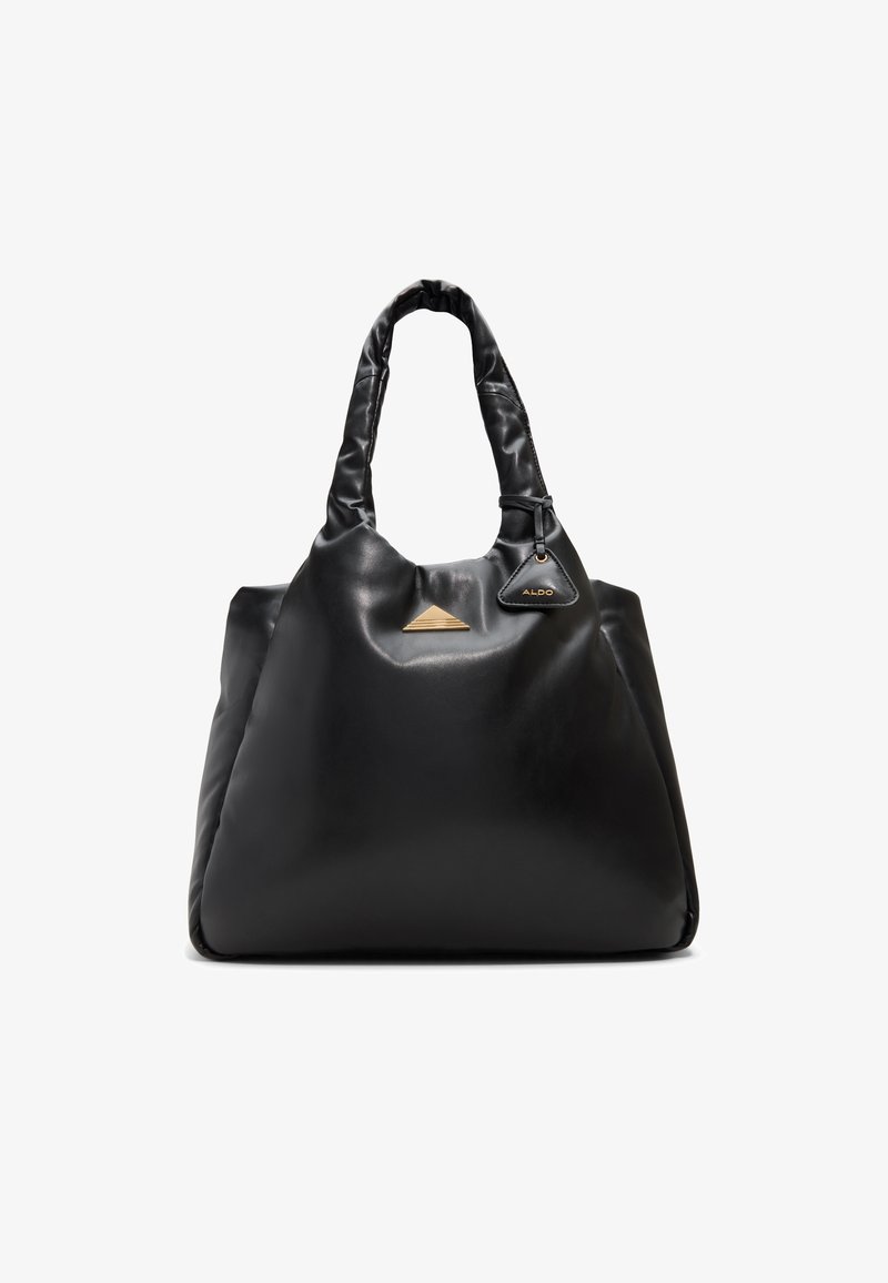 Black leather tote bag with a slouchy design. Features a triangular gold accent at the front and a detachable tag with branding.
