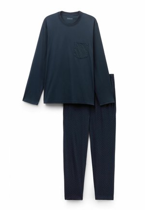 Marineblauw shirt met lange mouwen en een gestippelde zak, gecombineerd met bijpassende broek met kleine polkadots. Gemaakt van een katoenmix met een gladde textuur.