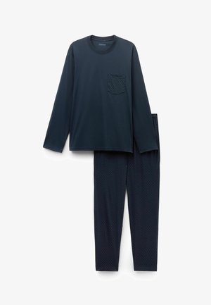 Granatowa koszula z długim rękawem z kropkowaną kieszenią, w połączeniu z pasującymi spodniami w drobne groszki. Tkanina z mieszanki bawełny, gładka w dotyku.