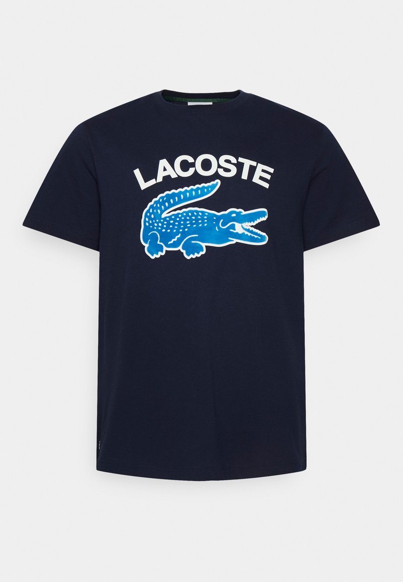 Lacoste Triko s potiskem marine/tmavě modrá Zalando.cz