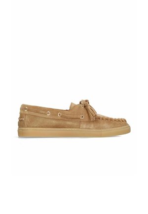 Tan suede moccasin shoe with rubber sole, lace detailing around the front, and a tassel on the top side.