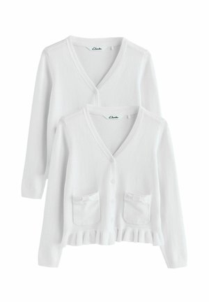 Vit cardigan med V-hals, knäppning framtill, två fickor med rosetter och en volangslutning. Tillverkad av mjukt, texturerat tyg.