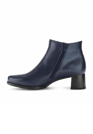 Bottine en cuir bleu marine pour femmes avec fermeture éclair latérale et talon bloc noir de hauteur moyenne, présentée de profil sur fond blanc.