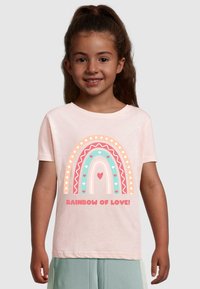 Light pink cotton t-shirt featuring a multicolored rainbow graphic with hearts, bordered by decorative patterns and text "RAINBOW OF LOVE!"