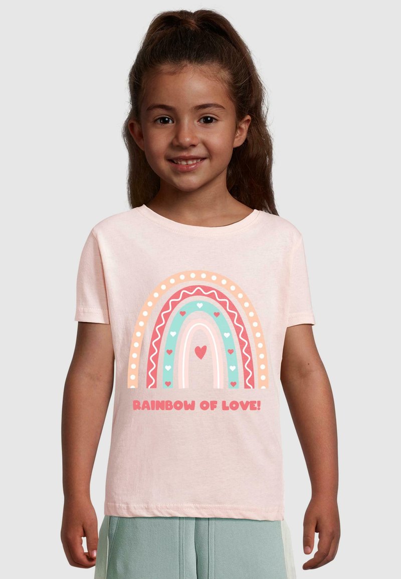 Light pink cotton t-shirt featuring a multicolored rainbow graphic with hearts, bordered by decorative patterns and text "RAINBOW OF LOVE!"