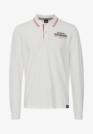 Pikkade varrukatega valge polo särk punaste krae triipudega, tikandiga logoga ja nööbiga fliis. Pehme kangas ja mugav lõige.