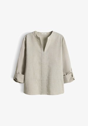 Beige Leinenbluse mit dreiviertellangen Ärmel zum Aufkrempeln und V-Ausschnitt ohne Kragen.