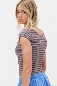 Striped short-sleeve top in brown, white, and blue tones. Features a round neckline and fitted design. Paired with light blue elastic waistband bottoms.