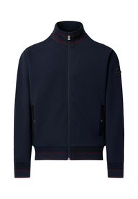 Tmavomodrá bunda na zips s vysokým golierom, červenými pruhmi na golieri, manžetách a spodnom okraji a so zapínacími vreckami na boku.