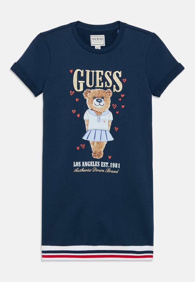 Ναυτικό μπλε φόρεμα με κοντά μανίκια, με γραφικό αρκούδας σε λευκό φόντο, με χρυσές και κόκκινες λεπτομέρειες, και ριγέ τελείωμα σε κόκκινο, λευκό και μπλε.