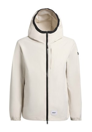 Giacca leggera color crema con cappuccio foderato in nero, chiusura con zip frontale e polsini elastici. Presenta un piccolo logo sull'orlo.