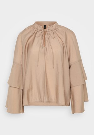 Beige blouse with a round neckline, tie detail, and tiered bell sleeves. Made from a lightweight, smooth fabric with a relaxed fit.