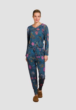 Floral-patterned, teal lounge set made of soft fabric. Features a long-sleeve top and tapered pants with an elastic waistband.