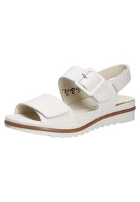 White leather sandal with an open toe, adjustable ankle strap and buckle, cushioned footbed, and a textured white rubber sole.