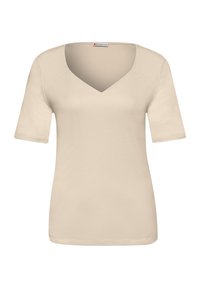 Chemise beige à manches courtes avec col en V, présentée de face sur un fond blanc.