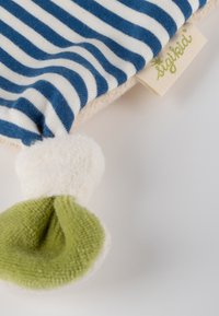 Soft fabric baby clothing with blue and white stripes, green and white fuzzy detail, and a beige SigiKid brand tag.