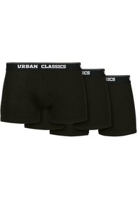 Schwarze Baumwoll-Boxershorts im Dreierpack. Ausgestattet mit elastischem Bund und weißem "URBAN CLASSICS"-Logo. Glatte Textur und figurbetontes Design.