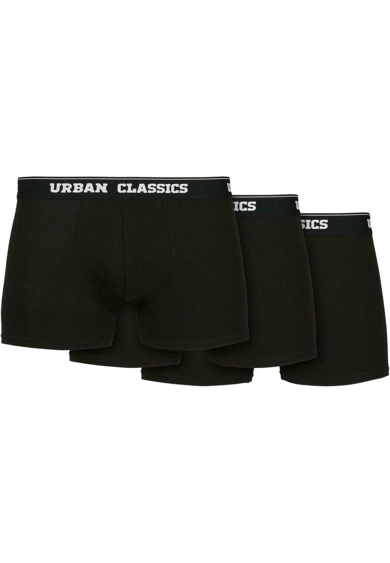 Schwarze Baumwoll-Boxershorts im Dreierpack. Ausgestattet mit elastischem Bund und weißem "URBAN CLASSICS"-Logo. Glatte Textur und figurbetontes Design.
