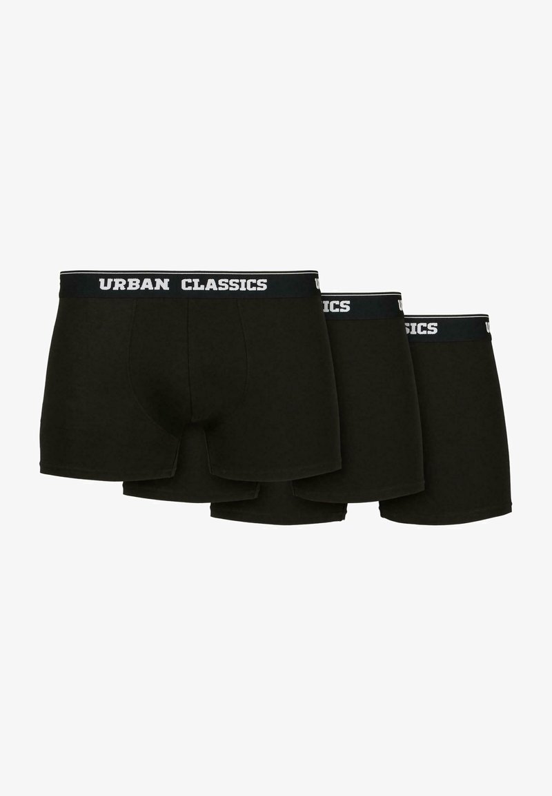 Caleçons en coton noirs dans un pack de trois. Ceinture élastique avec le logo "URBAN CLASSICS" en blanc. Texture lisse et design ajusté.