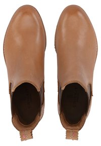 Tan leather ankle boots with elastic side panels, smooth texture, rounded toe, and a small pull tab at the back. Interior logo detail visible.