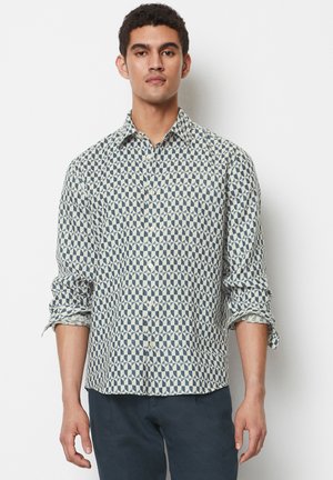 Hemd mit Knöpfen aus leichtem Stoff im creme- und marineblauen geometrischen Muster, mit klassischem Kragen und hochgerollten Ärmeln.