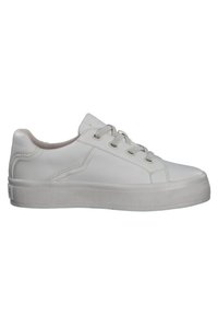 White synthetic sneakers with a smooth finish, round toe, lace-up design, and textured rubber sole. Features minimal stitching and eyelets.