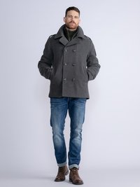 Gray wool peacoat with large collar and double-breasted buttons, paired with blue jeans and brown leather boots.