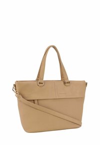 Sac en toile beige avec une partie supérieure en cuir texturé, deux anses courtes, une bandoulière réglable et un design minimaliste avec un branding subtil.