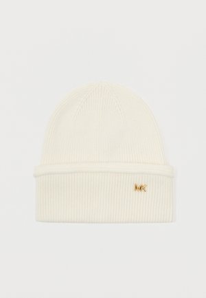 Cream knit beanie with a ribbed texture, featuring a folded cuff and a small gold MK logo on the front.