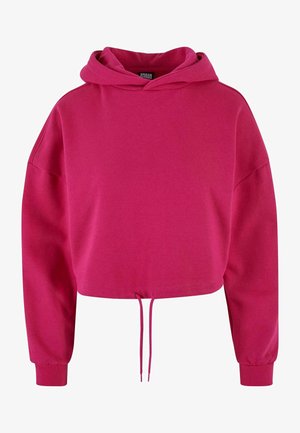 Hoodie corto in un brillante colore rosa, realizzato in morbido tessuto. Presenta un cordino all'orlo e maniche lunghe con polsini elasticizzati.