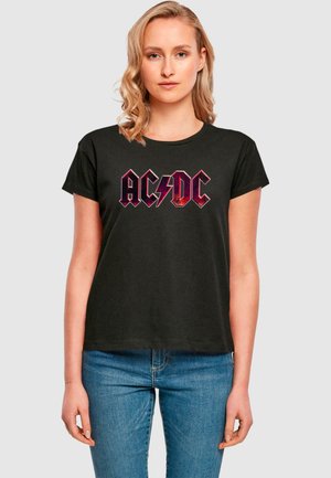 Black cotton t-shirt featuring red and black AC/DC logo design. Short sleeves, crew neck, and relaxed fit. Simple style, no patterns or accents.