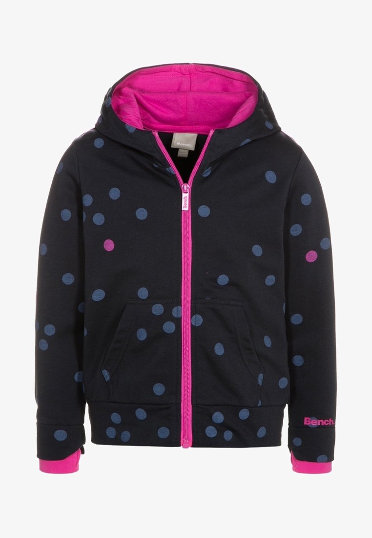 Felpa nera con zip e interno rosa, caratterizzata da pois multicolori. Include una tasca frontale e il logo "Bench." in rosa sulla manica.