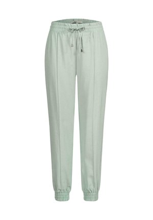 Pantalons de jogging vert clair en tissu doux avec une taille élastique, un cordon de serrage et des poignets élastiques aux chevilles. Détails de couture verticale.