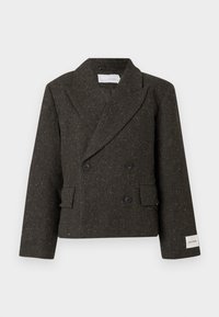 Sötétbarna, dupla soros zakó texturált anyagból, finom aranyszínű szálakkal. Nagyméretű fekete gombokkal és oldalzsebekkel rendelkezik.