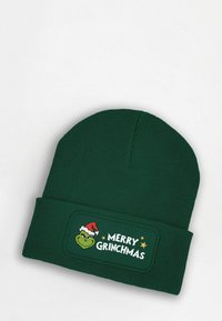 Green knit beanie with ribbed texture. Features a patch with the Grinch wearing a Santa hat and text “MERRY GRINCHMAS.”