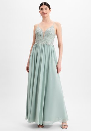 Langes, mintgrünes Kleid mit tiefem V-Ausschnitt, verziertem Oberteil und fließendem Rock. Hat dünne Träger und eine leicht geraffte Taille.