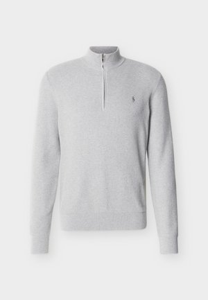 Light gray long-sleeve knit pullover with half-zip collar and subtle logo on left chest, featuring textured fabric and ribbed cuffs and hem.