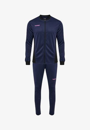 Marineblåt træningssæt med fuld lynlås, sorte sidepaneler, ribbet manchetter og pink "hummel" logoer på bryst og venstre lår.