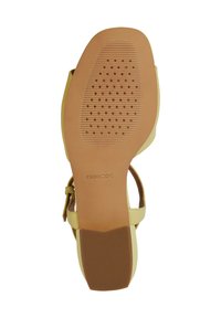 Sandalo beige con suola in gomma marrone testurizzata, caratterizzata da un motivo circolare e lineare per una migliore aderenza. Cinghie in pelle liscia.