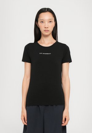 Black short-sleeve t-shirt in cotton with a round neckline and a white logo "EA7 Emporio Armani" printed on the chest.