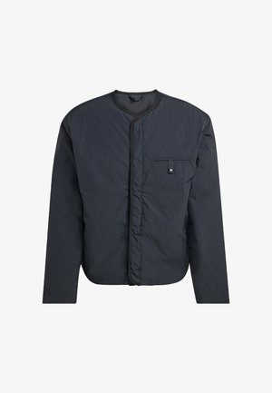 Dark gray, long-sleeve jacket with round neckline, front snap button pocket on chest, and padded texture, shown on white background.