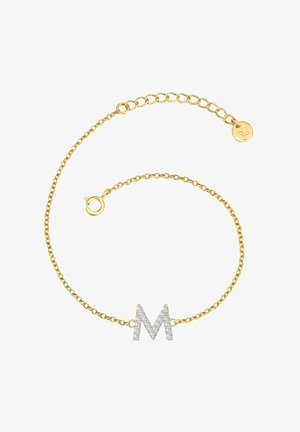 Zlatý náramok s ozdobným strieborným písmenom 'M'. Oválne články, nastaviteľná dĺžka a uzáver na karabínu. Lesklý, brúsený povrch.